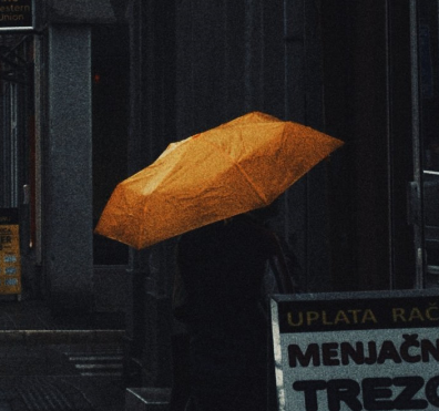 Figure with an umbrella.